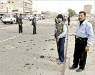 Police secure the area where  abomb exploded in Baghdad 