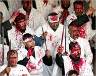 Shia Muslims flagellate themselves during Ashura 