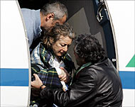 Calipari was killed while escorting Giuliana Sgrena (C) to the airport 