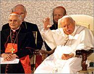 Some hope Ratzinger (L) will continue John Paul's policies