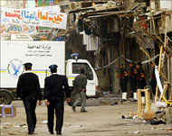 Police inspect the bazaar in Khan al-Khalili