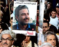 Demonstrators in Paris observe a moment of silence for Samir Kassir