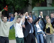 The hostages celebrate with President Traian Basescu (C)