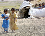 Bedouin children waving at passengers is a common sight