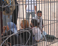 ISM activists in a cage they builtto represent Palestinian captivity