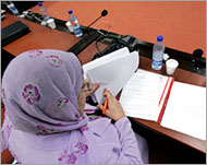 A member of the constitution panel browses through a copy of the draft