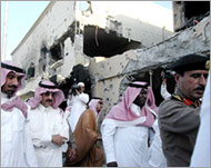 Saudi officials tour the site ofthe gun battle in Dammam