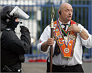 Members of the Orange Order (R)were accused of starting the riots