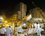 Rescuers remove debris from the collapsed Margalla Tower building 