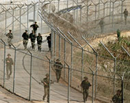 Forces patrol the fence at one of the Spanish enclaves