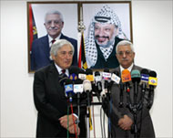 Envoy James Wolfensohn (L) briefed Abbas on Friday