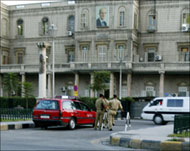 Police stand guard on at the Interior Ministry in Damascus on Wednesday