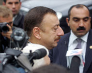 Azeri President Ilham Aliyev (C)after casting his vote
