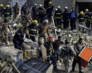 Defence workers tried to pull victims out of the rubble