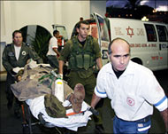 A wounded Israeli soldier is taken into Rambam hospital