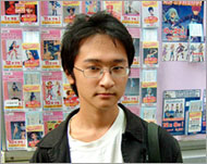Toshiyuki Takano outside a shopspecialising in movie figurines