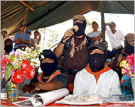 Zapatista leader Marcos (C) has promised a non-violent campaign