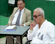 Lawyer Badie Arif Ezzat (L), saidAziz was weeks from death 