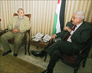 Hamas officials have met withMahmud Abbas (R) 