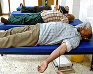 Iraqis donate blood at a hospital in Baghdad
