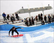 Facilities aboard the ship include a pool with waves for surfers