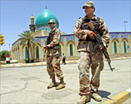 Security outside a Shia mosquetestifies to sectarian tensions