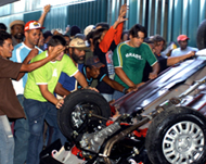 Protesters overturn a car at the entrance of the congress in Brasilia