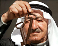 A Palestinian refugee displays a key which symbolises his return 