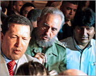 Venezuela's Chavez (L) has named the trinity as the 'axis of good' 