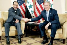 handshake between al-Maliki and Bush