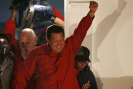 Venezuelan President Hugo Chavez greets hundreds of supporters from the balcony of the Miraflores Palace in Caracas