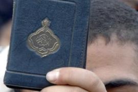 Muslim Brotherhood member holds Quran