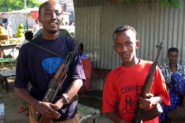 Somali militiamen hold weapons they looted after Islamists Courts Council fled Mogadishu