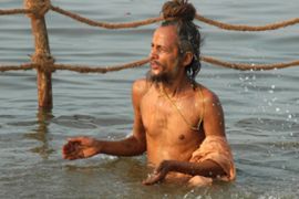 HIndu pilgrim bathes in the Ganges river, India