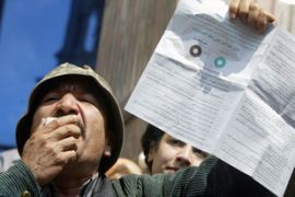 Opposition activist holds up referendum ballot paper