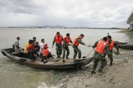 Soldiers relocate people ahead of typhoon