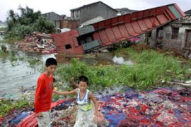 Children play after typhoon sepat