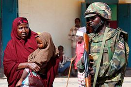 Somalia Mogadishu AU peacekeeper woman child