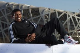 BEIJING - FEBRUARY 04: Haile Gebrselassie of Ethiopia poses in front of the National Stadium on February 4 , 2008 in Beijing China. (Photo by Adam Pretty/Getty Images for adidas)