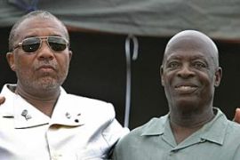 Liberian President Charles Taylor (L) and Vice President Moses Zeh Blah