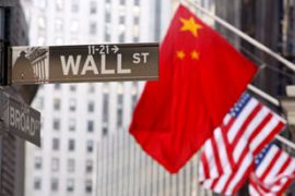 Chinese flag outside stock market in wall street