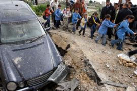 Car destroyed by blast in Mieh Mieh refugee camp