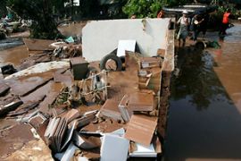 Rescuers search for victims of a flood in south Jakarta