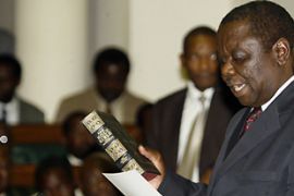 Zimbabwe''s new Prime Minister Morgan Tsvangirai (2nd R) takes oath