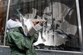 Anti-G20 activist smashes window of Royal Bank of Scotland