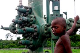 Nigerian boy near Niger Delta oil pipeline