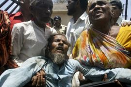 Bhopal victim fainting during demonstration in India