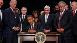 President Barack Obama signs the the financial reform bill