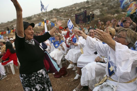 Supporters of Jewish settlement building take part in a rally in the West Bank settlement of Revava