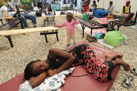 Sick victims and families wait for treatment at St. Nicolas Hospital in St. Marc